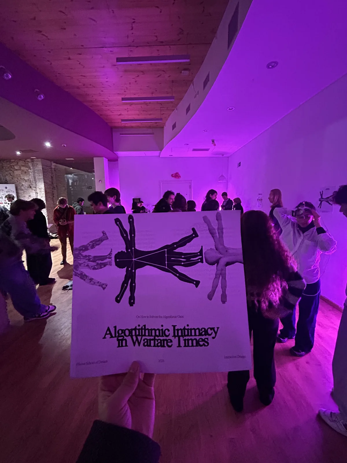 The flyer, held up in the room