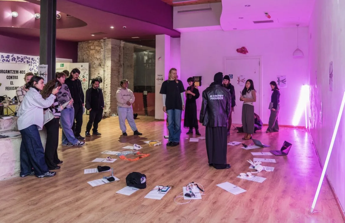 The room, visitors gathered round
