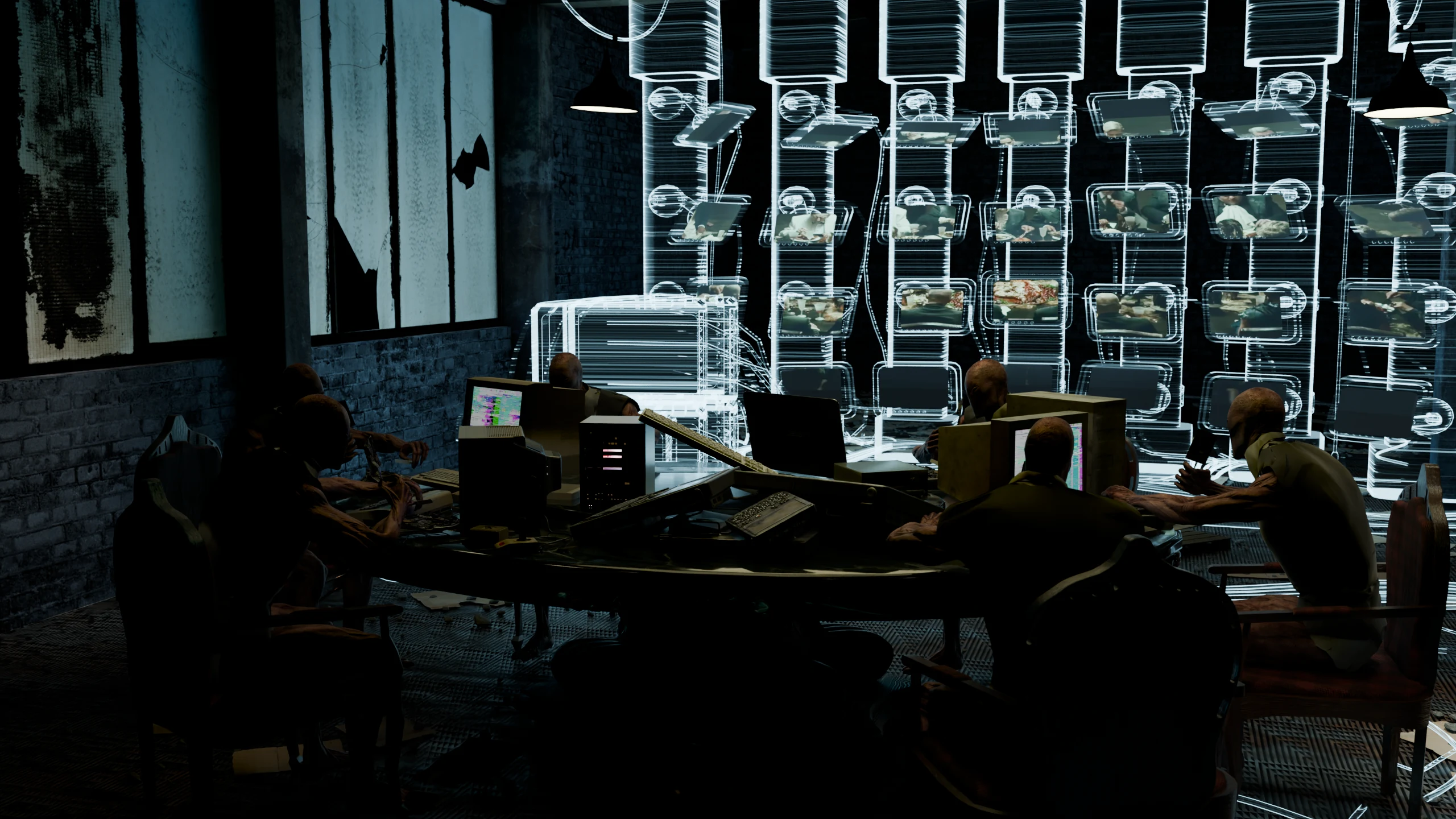 Round the table: the diners, the dishes of hardware and the screen wall behind them.
